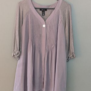 Smock-like top. Slight imperfection.